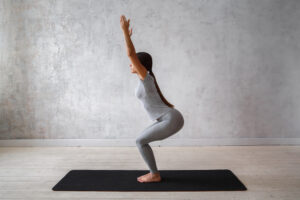 Woman Practicing Advanced Yoga Poses Chair