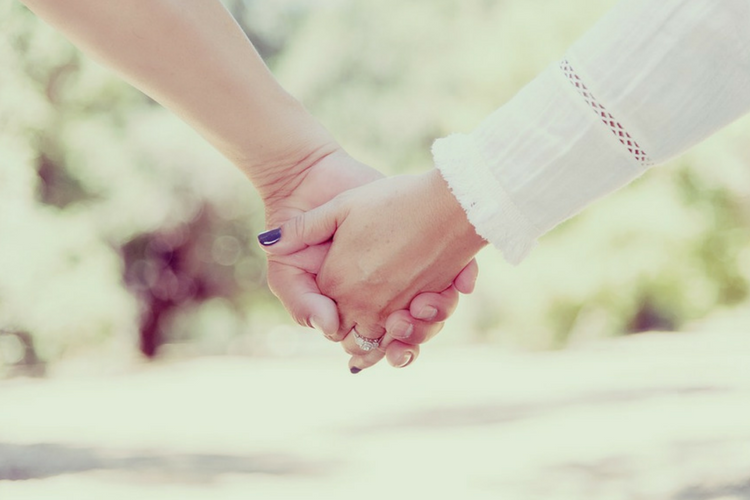 Couple holding hands