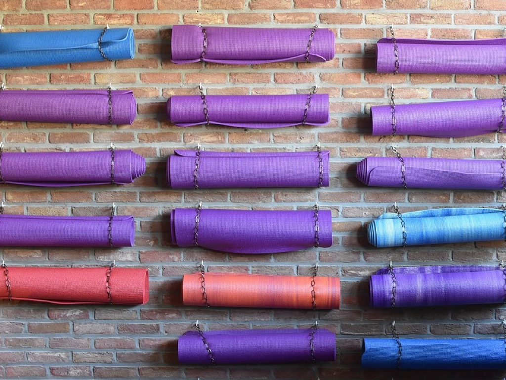 yoga mats hang on wall