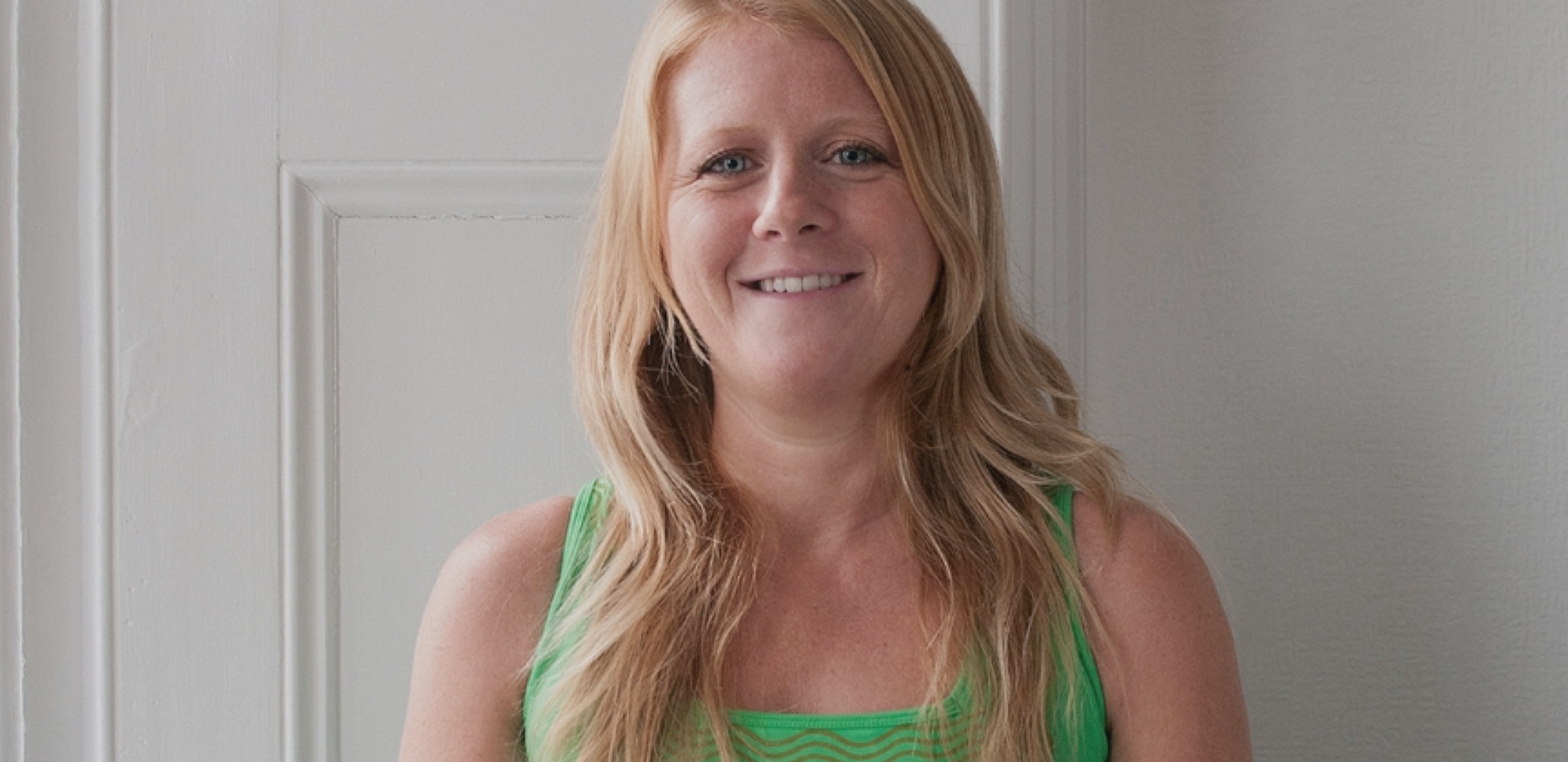 Yoga teacher Louise Windsor head shot against white backdrop
