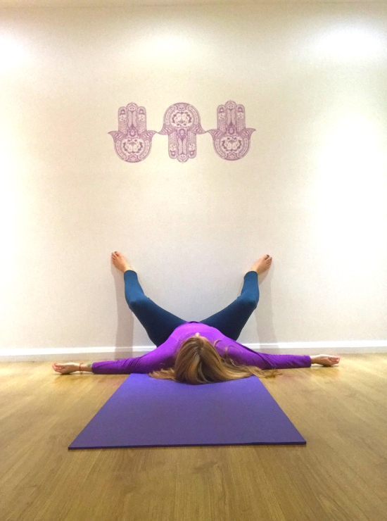 squat legs up the wall yin yoga pose ease back pain
