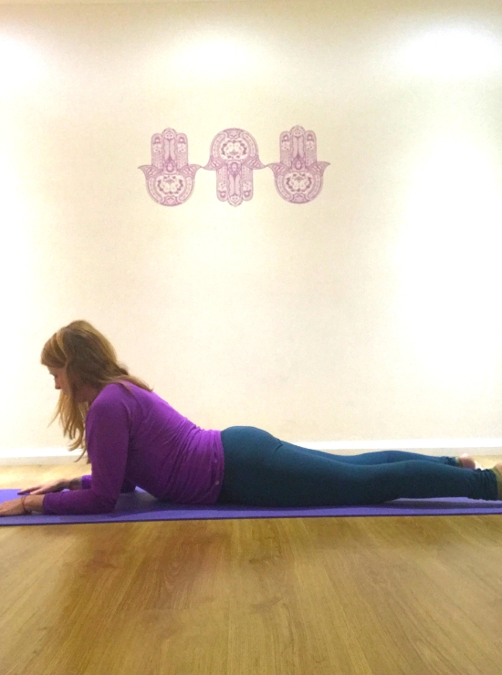 sphinx yoga pose lie on floor sit up on forearms yin yoga pose ease back pain