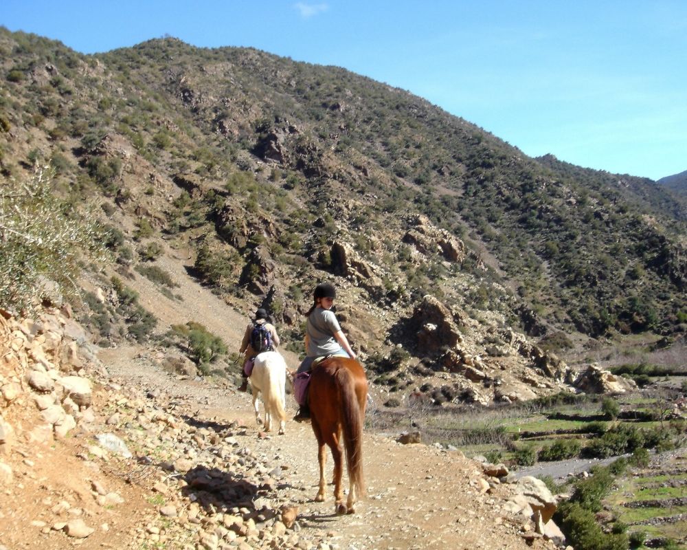 two girls horseriding in atlas mountains
