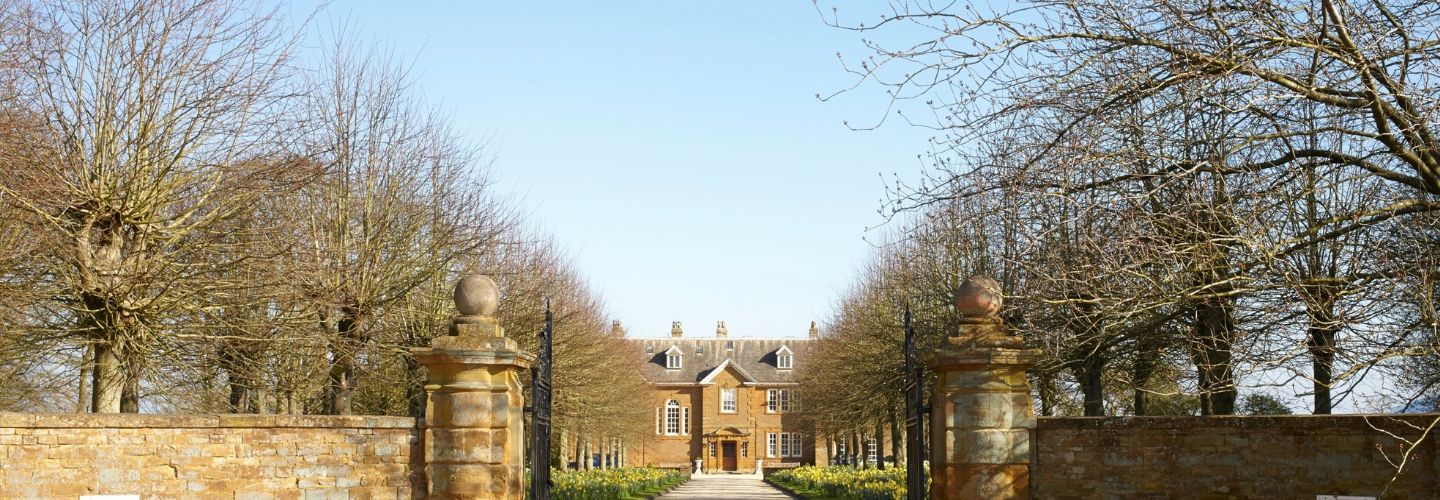 oxford venue in distance down wintery tree lined stone driveway