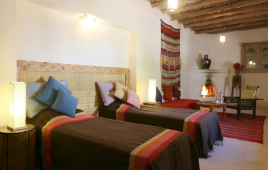 twin beds and seating area yoga holiday Marrakech