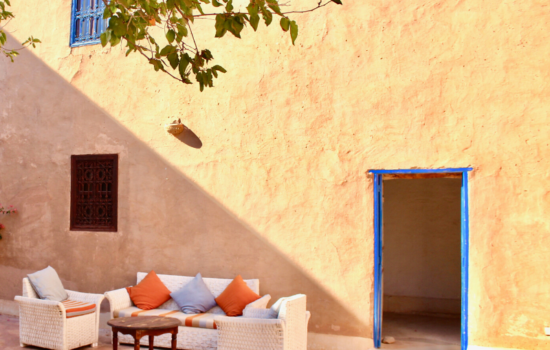 sofa and cushions in morrocan style courtyard yoga holiday Marrakech