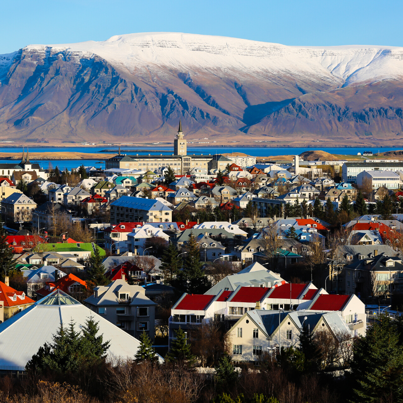 view of reykjavik and snowcapped mountains adventure yoga holiday Iceland