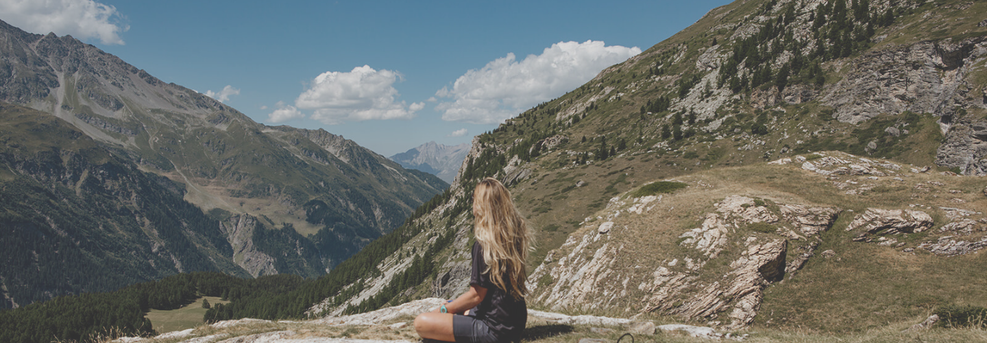 girl meditating in mountains