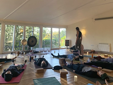 people in shavasana in yoga studio