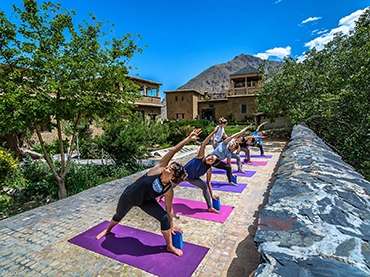 people doing yoga outdoors in the atlas mountains