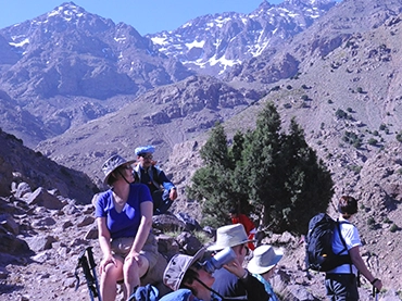 people ascending mount toubkal looking at the views