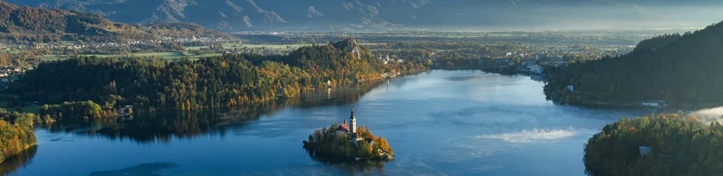 aerial view of lake in slovenia with small island