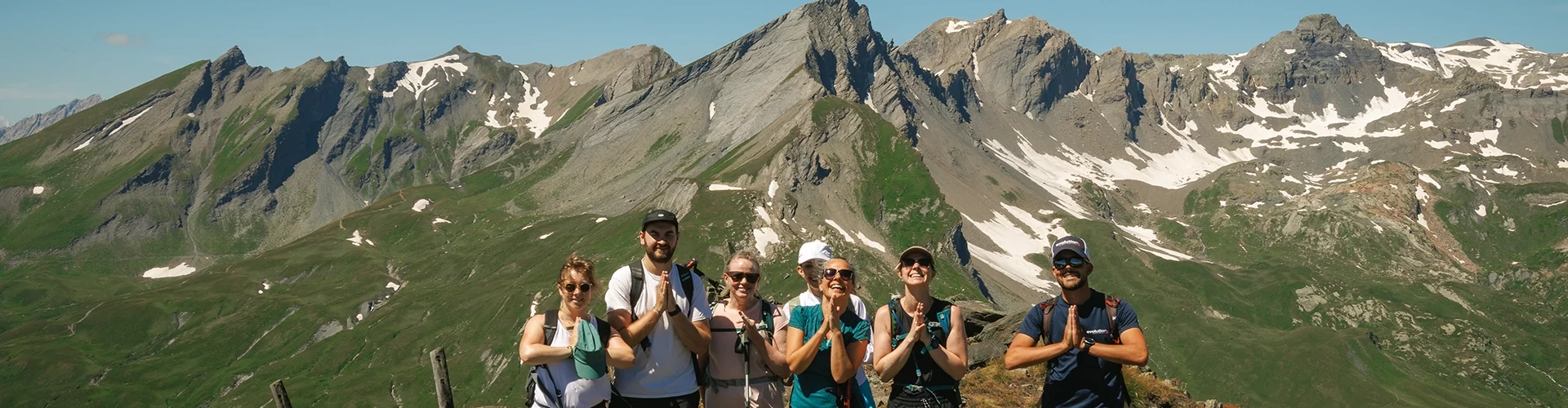 people doing yoga hands in the french alps