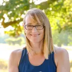 nicky dye yoga teacher smiling to camera outside
