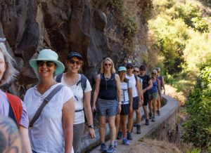A group of happy yoga retreat guests hiking in Madeira